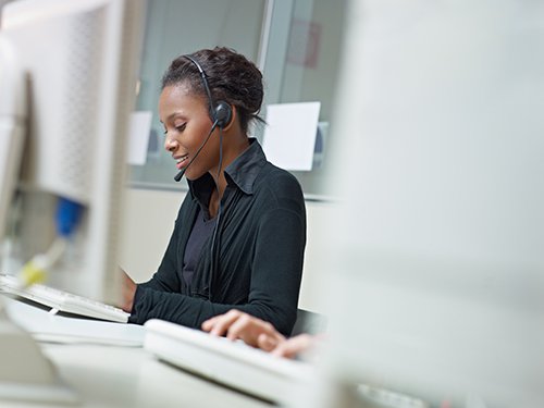 graphicstock-female-african-american-customer-service-representative-talking-on-the-phone-and-typing-on-pc-horizontal-shape-side-view-copy-space_r2vyWO9DZ (1).jpg