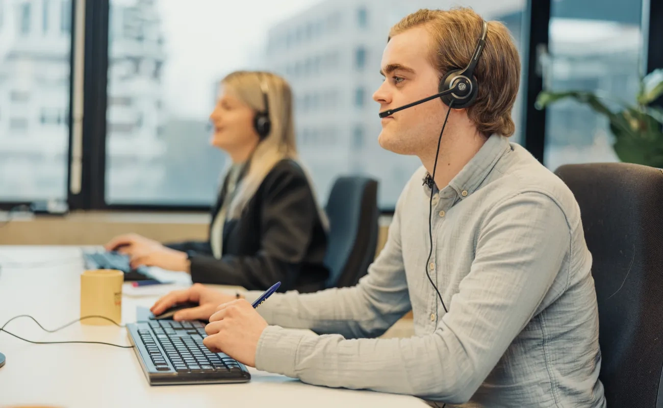 Boy and girl with headset at work