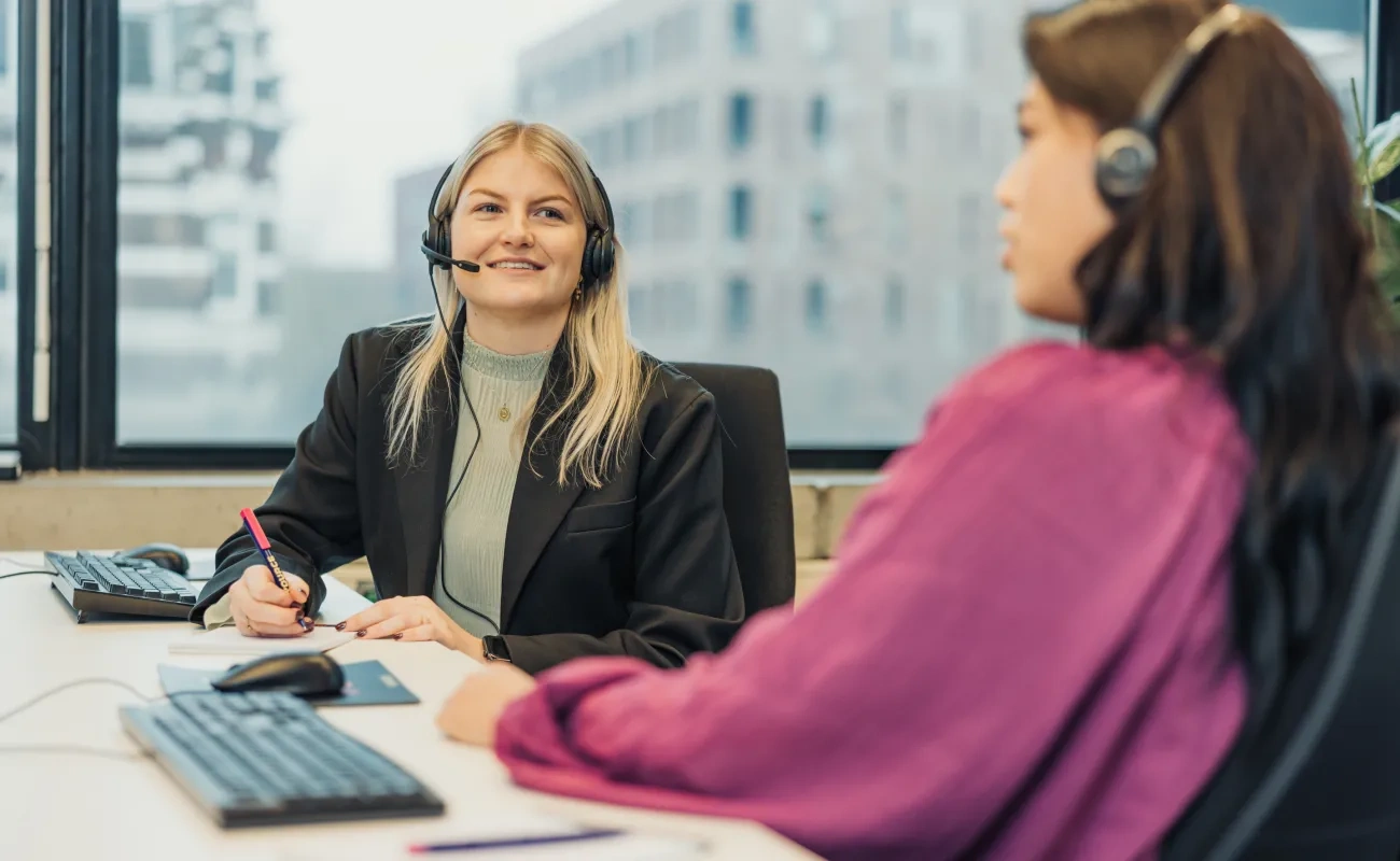 Two girls with headset chatting