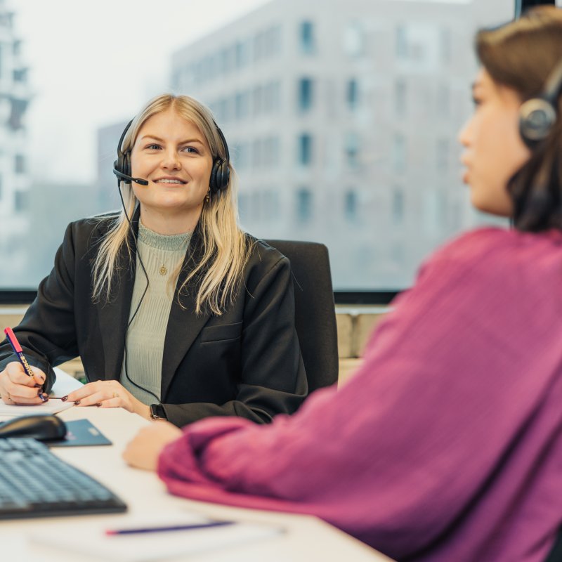 Two girls with headset chatting